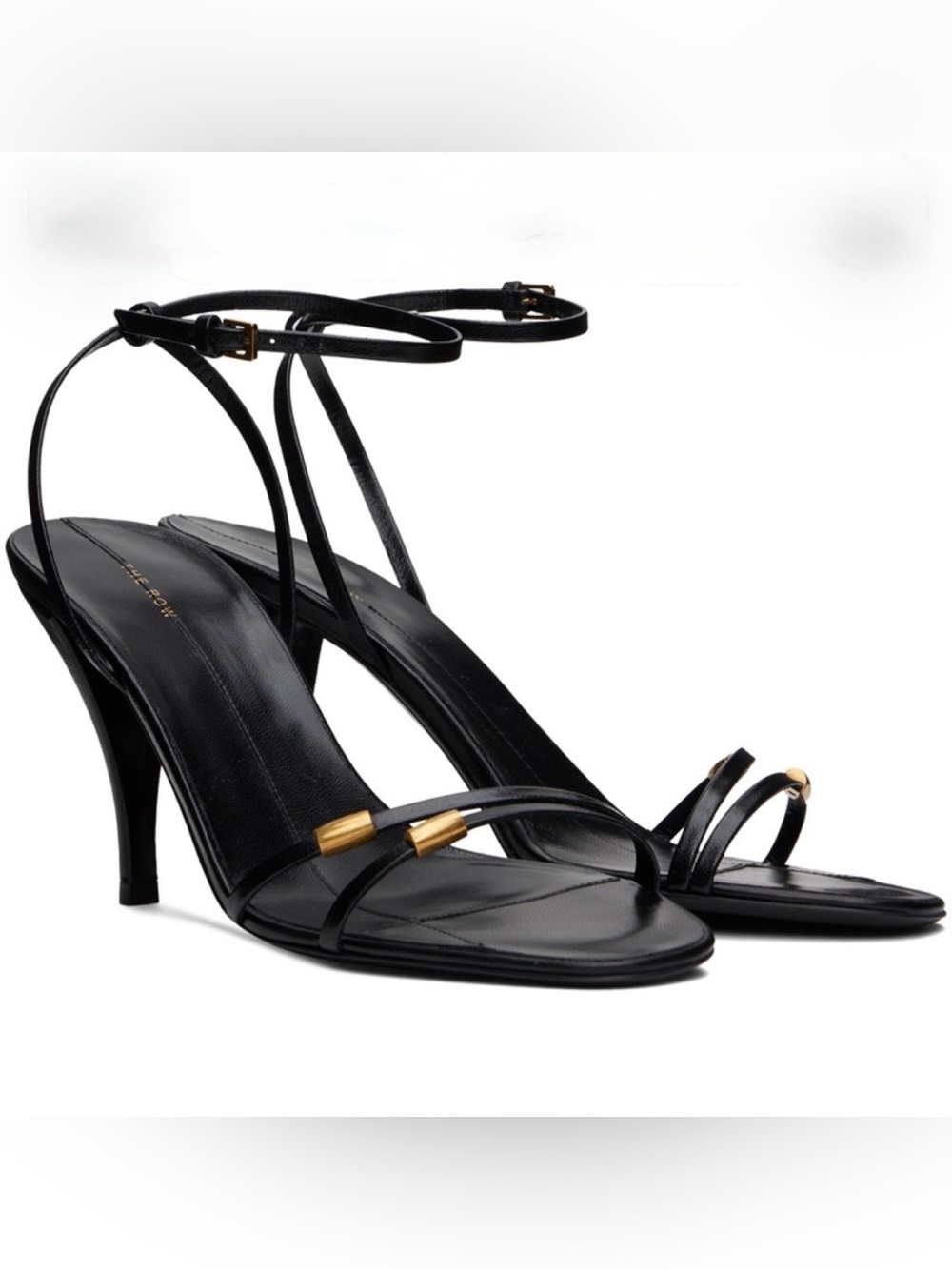 The Row Black Strappy Ankle-Tie Heeled Sandals with Gold Accents